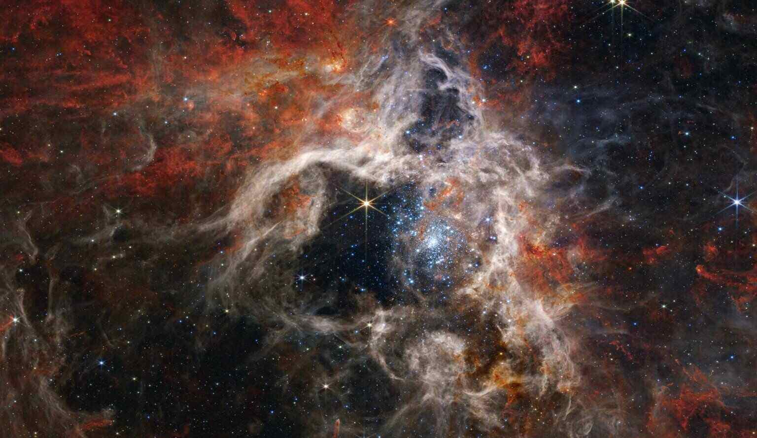 Exploring the Mysteries of the Tarantula Nebula: A Cosmic Ballet of Light and Gas